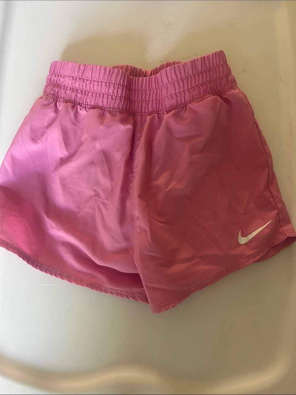 Nike Women’s Pink Athletic Running Shorts with White Swoosh